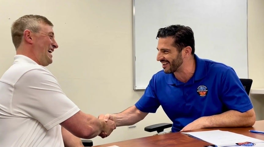 phil depaul handshake with partner